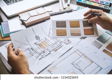 Architect designer Interior creative working hand drawing sketch plan blue print selection material color samples art tools Design Studio - Shutterstock ID 1154323693