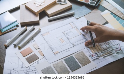 Architect designer Interior creative working hand drawing sketch plan blue print selection material color samples art tools Design Studio - Shutterstock ID 1154323696