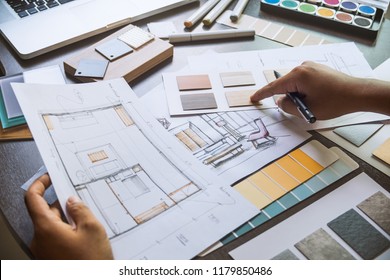 Architect designer Interior creative working hand drawing sketch plan blue print selection material color samples art tools Design Studio - Shutterstock ID 1179850486