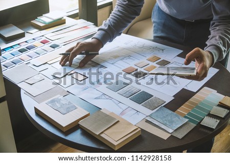 Architect designer Interior creative working hand drawing sketch plan blue print selection material color samples art tools Design Studio
