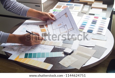 Architect designer Interior creative working hand drawing sketch plan blue print selection material color samples art tools Design Studio