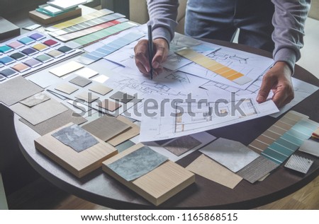 Architect designer Interior creative working hand drawing sketch plan blueprint selection material color samples art tools Design Studio