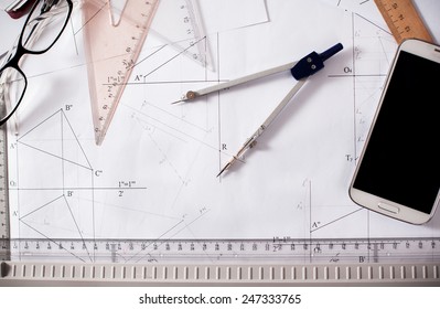 Architect Desk With Paper, Ruler, Compasses And Mobile Phone