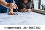 Architect drafting blueprint for interior project in modern office