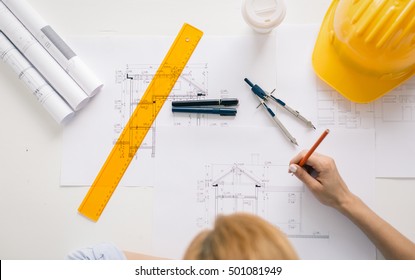 Architect Drawing Blueprints. Architectural/engineering Concept