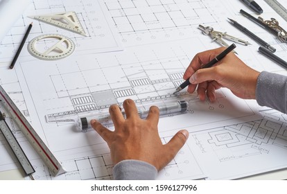 Architect engineer contractor design working drawing sketch plan blueprint and making architectural construction house building.                              - Shutterstock ID 1596127996