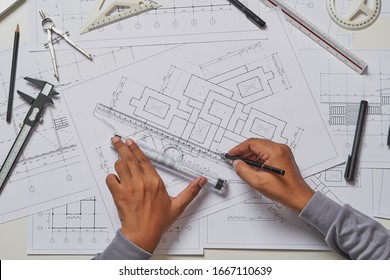 Architect engineer contractor design working drawing sketch plan blueprint and making architectural construction house building in architect studio.                             