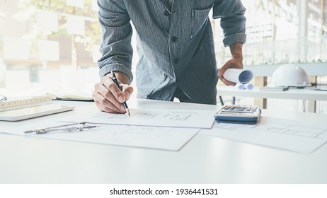 Architect Engineer Design Working on Blueprint Planning Concept. Construction Concept - Shutterstock ID 1936441531