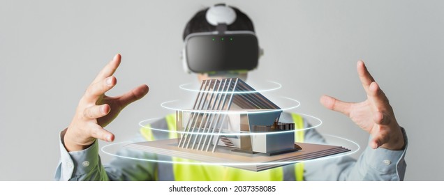 Architect or Engineer designer wearing VR headset for BIM technology working design 3D house model in building complete.
