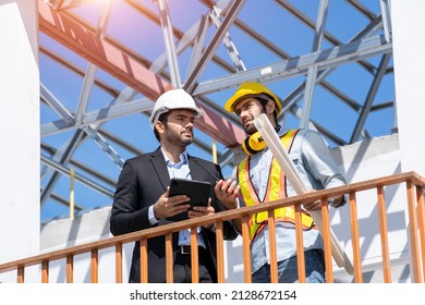 Architect and engineer foreman discussion for plans for new home and working on a building site,Home inspector reviews documents.