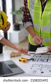 architect and engineer Hand Drawing Plan On Blue Print with architect equipment, Architects discussing at the table, team work and work flow construction concept. - Shutterstock ID 2108201492