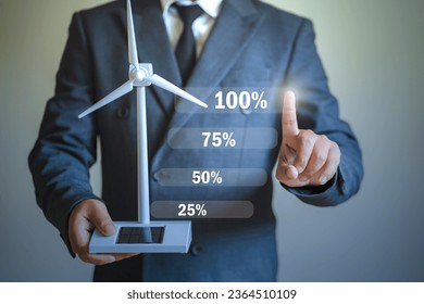 Architect or engineer holding a small windmill solar panel Hand select to the highest bar. The concept of sustainability in renewable energy Designing and creating clean energy - Powered by Shutterstock - Get 15% off with code: PIKWIZARD15