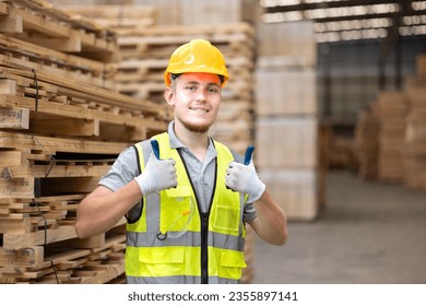 Architect engineer man worker showing thumbs up in factory for the production of furniture, wood factory. Inspecter factory worker with good quality of wooden products at import export wood warehouse. - Powered by Shutterstock