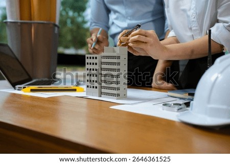 architect or engineer team working on table use drawing tool on the paper plan for business architectural project.	