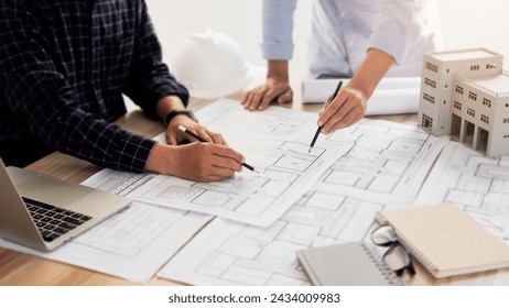 Architect engineer working concept. Engineer Architects office team working and discussing house.