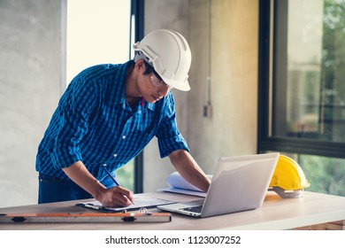 Architect & Engineer Working Drawing Document About Project Planning And Progress Of Work Schedule On The Home Building Construction Site