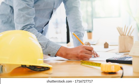 Architect engineer working in office and blueprints engineer inspection in workplace for architectural plan sketching construction project  selective focus Business construction concept 