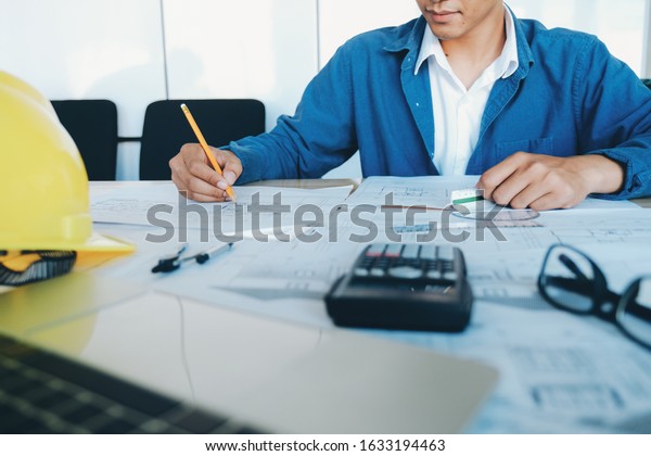 Architect or engineer working in office,
Construction concept. Engineering
tools.