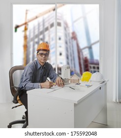 Architect Engineer Working In Office Room Against Building Construction Through Mirror Window  Use For Architecture And Engineering Construction Industry Business Theme And Real Estate Land Management