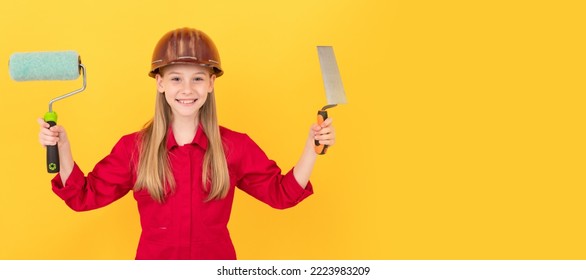 Architect Girl. Smiling Teen Child In Builder Hard Hat With Paint Roller And Spatula On Yellow Wall. Child Builder In Helmet Horizontal Poster Design. Banner Header, Copy Space.