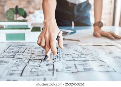 Architect, hand and blueprint on paper in office with property design, planning and pencil for review. Person, drawing and sketch with document, engineering and floor plan in workplace closeup - Powered by Shutterstock