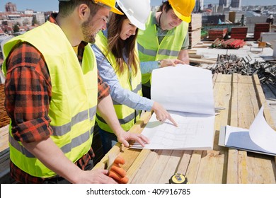 Architect Having A Meeting With Construction Team On Site