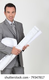 Architect holding plans - Shutterstock ID 79347817