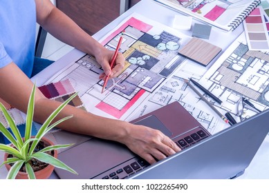 Architect, Interior Designer (Artist Creative) Working At Table With Drawing Sketch, Laptop Computer In Office / Home Renovation, Decoration & Real Estate Conceptual