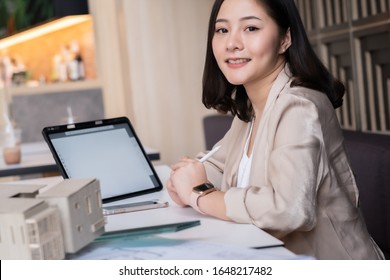 Architect or interior designer working with material sample board in showroom. Business of Real estate, home decoration .Creative people workplace.  young designer woman working . - Shutterstock ID 1648217482