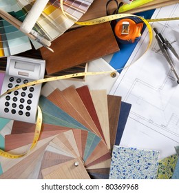 Architect Or Interior Designer Workplace Desk And Design Tools With Lots Of Construction Material Samples