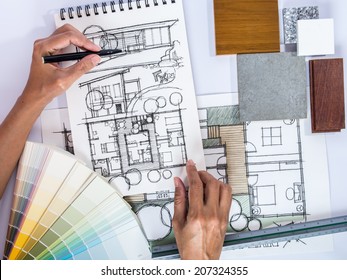 Architect /interior's Hands Drawing Home Illustration With Material Sample, Renovation  Concept