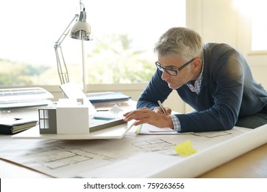 Architect in office working on 3D model