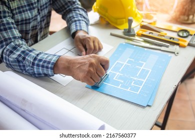 architect old man working with blueprints,engineer inspection in workplace construction site