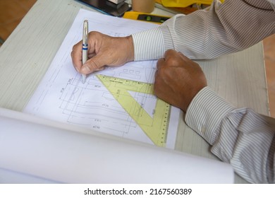 architect old man working with blueprints,engineer inspection in workplace construction site