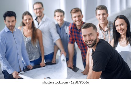 architect on the background of the project office staff - Shutterstock ID 1258795066