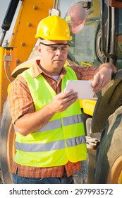 Architect On Building Site Using Digital Tablet