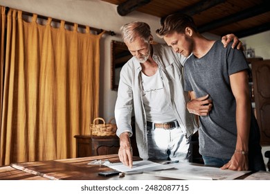 Architect, senior father and man with plans for home improvement, support and design in office. Elderly mentor, apprentice and son at desk for engineering, brainstorming and trust in family business - Powered by Shutterstock