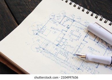 Architect, sketch, house plan with fountain pen - Shutterstock ID 2104997636