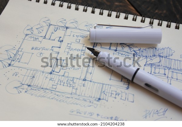 Architect, sketch,\
house plan with fountain\
pen