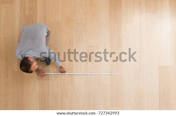 Architect Taking Measures New Hardwood Floor Stock Photo