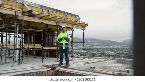Architect, thinking and man with tablet on roof, building inspection or planning for home renovation. City, architecture and black person with tech on construction site, idea and property development