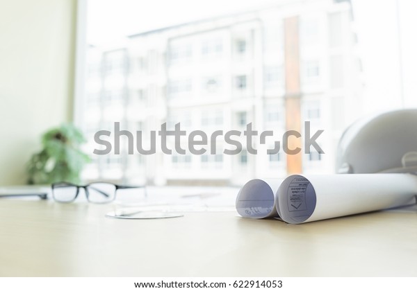 architect tools with architecture blueprint on desk\
in office, engineering concept, architecture concept, soft focus,\
vintage tone