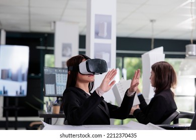 Architect In Vr Headset Working On Project In Metaverse. Asian Employee Engineering In Architecture Office, Using Virtual Reality Glasses, Real Estate Agency Worker In Ar Goggles.