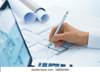 Architect Woman Drawing On Print Construction Project