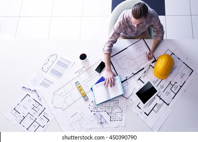 Architect Working With Blueprints