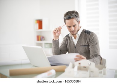 architect working at his laptop on the office