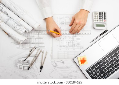 Architect working blueprint 