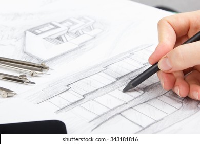 Architect working on blueprint. Architects workplace -  architectural project, plan, drawing, sketch and divider compass, pencil. Construction concept. Engineering tools - Shutterstock ID 343181816