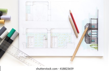 Architect working on blueprint. Architects workplace - architectural project, blueprints. Construction concept with Engineering tools. Top view with color illustration - Shutterstock ID 418823659