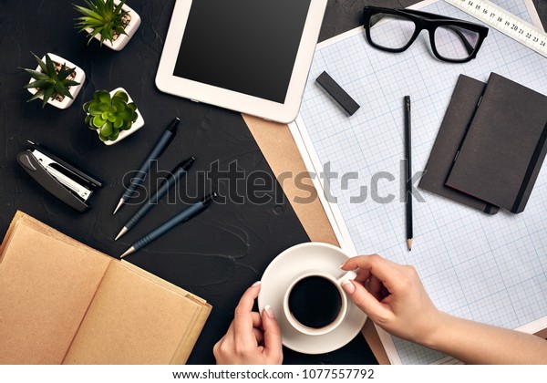 Architect working on blueprint. Architects workplace\
- architectural project, blueprints, tablet pc. Engineering tools.\
Top view
